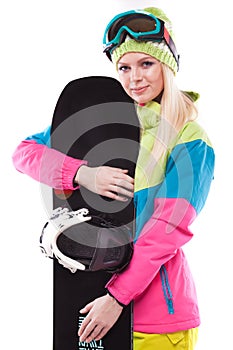 beautiful young woman in ski outfit and ski glasses hold snowboa