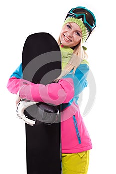 beautiful young woman in ski outfit and ski glasses hold snowboa