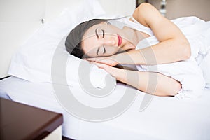 Beautiful young woman sleep on the bed at home