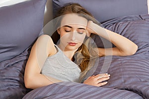 Beautiful Young woman sleep in bed. Sleep girl comfort