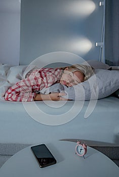 Beautiful young woman sleeping in bed.