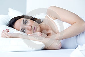 Beautiful young woman sleeping in the bed.