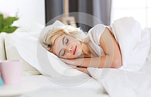 Beautiful young woman sleeping in bed in the morning