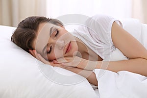 Beautiful young woman sleeping while lying in her bed. Concept of pleasant and rest reinstatement for active life