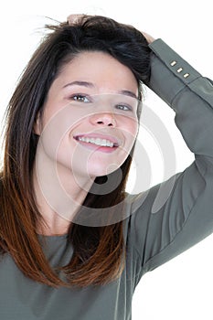 Beautiful young woman smiling without make-up on white background