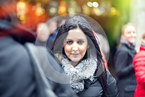 Beautiful young woman smiling outdooors.