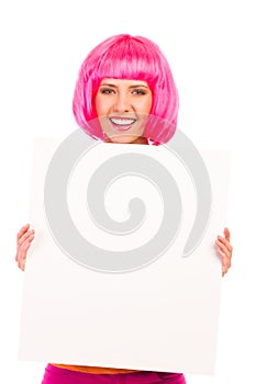 Beautiful young woman smiling and showing a blank white board.