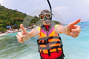 Beautiful young woman with snorkeling equipment