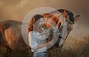 Beautiful  young woman on spanish buckskin horse in rue field