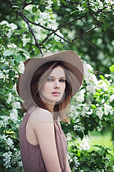 Beautiful Young Woman on Spring Blossom