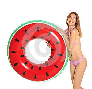 Beautiful young woman in stylish bikini with watermelon inflatable ring