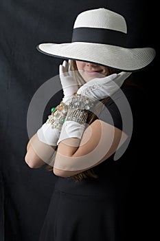 Beautiful Young Woman with Stylish Floppy Hat, Long Vintage White Gloves and Jewelry