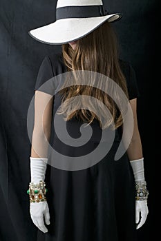 Beautiful Young Woman with Stylish Floppy Hat, Long Vintage White Gloves and Jewelry