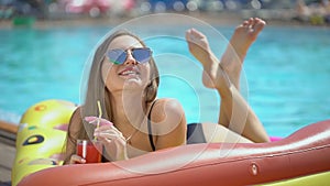 Beautiful young woman in summer. Bikini girl havin fun in tropical swimming pool. Beautiful young woman in summer