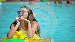 Beautiful young woman in summer. Bikini girl havin fun in tropical swimming pool. woman taking sunbath. The concept