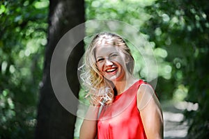 Beautiful young woman in the summer park