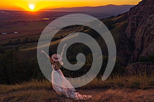 Beautiful young woman at sunset