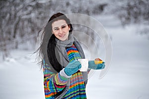 Beautiful young woman in a sweater. Winter outdoors walk with a