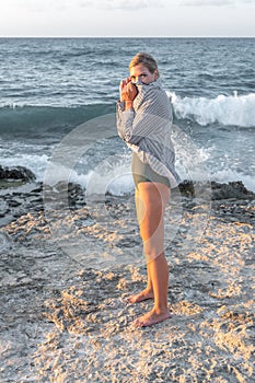 Beautiful young woman in swimsuit on the beach. Fashion concept