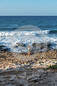 Beautiful young woman in swimsuit on the beach. Fashion concept