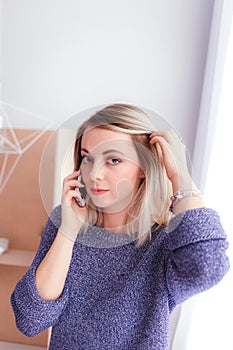 Beautiful young woman talking on the mobile phone