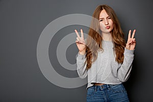 Beautiful young woman, teenager counts funny to 2