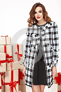 Beautiful young woman thin slim figure evening makeup fashionable stylish coat, clothing collection, brunette, gifts boxes re