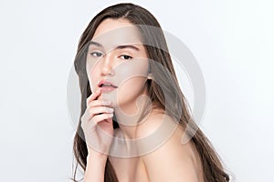 Beautiful Young Woman touching her clean face with fresh Healthy Skin, isolated on white background, Beauty Cosmetics and Facial