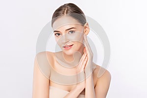 Beautiful Young Woman touching her clean face with fresh Healthy Skin,  on white background, Beauty Cosmetics and Facial
