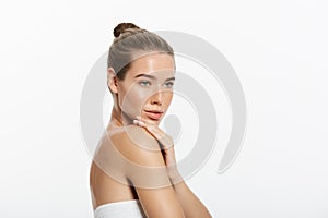 Beautiful Young Woman touching her skin. Beauty and Skin care concept.
