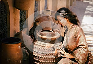 Beautiful young woman in a traditionally Moroccan caftan.