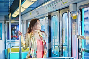 Beautiful young woman travelling in a train