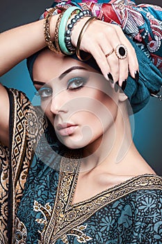 Beautiful young woman in turban and jewelry. beauty girl. oriental style