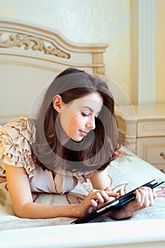 Beautiful young woman using digital tablet computer
