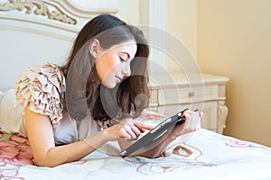 Beautiful young woman using digital tablet computer