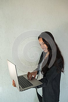 Beautiful young woman using a laptop computer