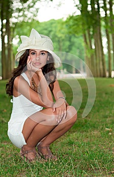 Beautiful young woman in Versailles Gardens