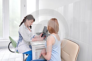 Beautiful young woman visiting doctor