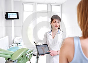 Beautiful young woman visiting doctor