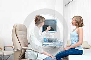 Beautiful young woman visiting doctor