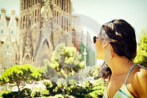 Beautiful young woman visits Barcelona