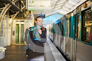 Beautiful young woman waiting for a train