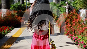 Beautiful young woman walking