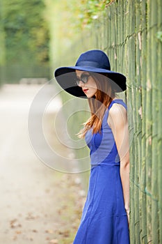 Beautiful young woman walking in the park, versailles