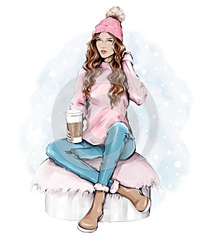 Beautiful young woman in warm knitted hat. Trendy casual fashion winter outfit. Pretty woman holding paper coffee cup. Winter look