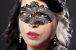 Beautiful young woman wearing a face masque