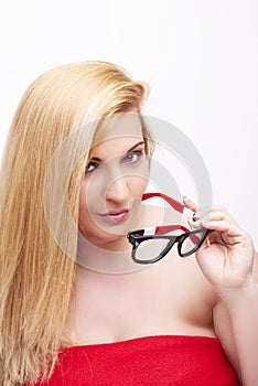 Beautiful young woman wearing glasses close-up isolated on white background