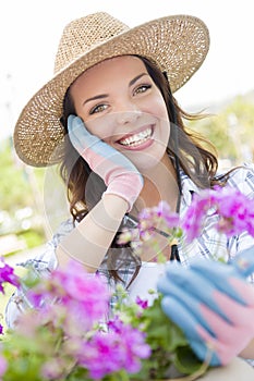 Beautiful Young Woman Wearing Hat Gardening Outdoors