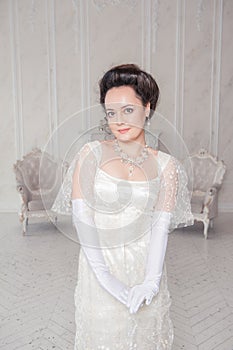 Beautiful young woman wearing medieval vintage Edwardian Style dress