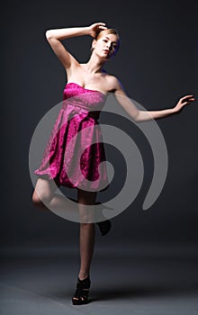 Beautiful young woman wearing pink dress